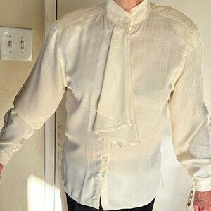A long sleeve blouse with decorative front.this blouse